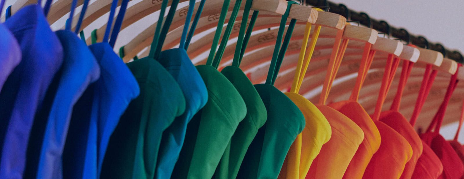 Colorful garments on hangers